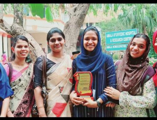 Receiving award of appreciation at Amala Institute of Medical Science, Trichur for their hair donation campaign for cancer patients.
